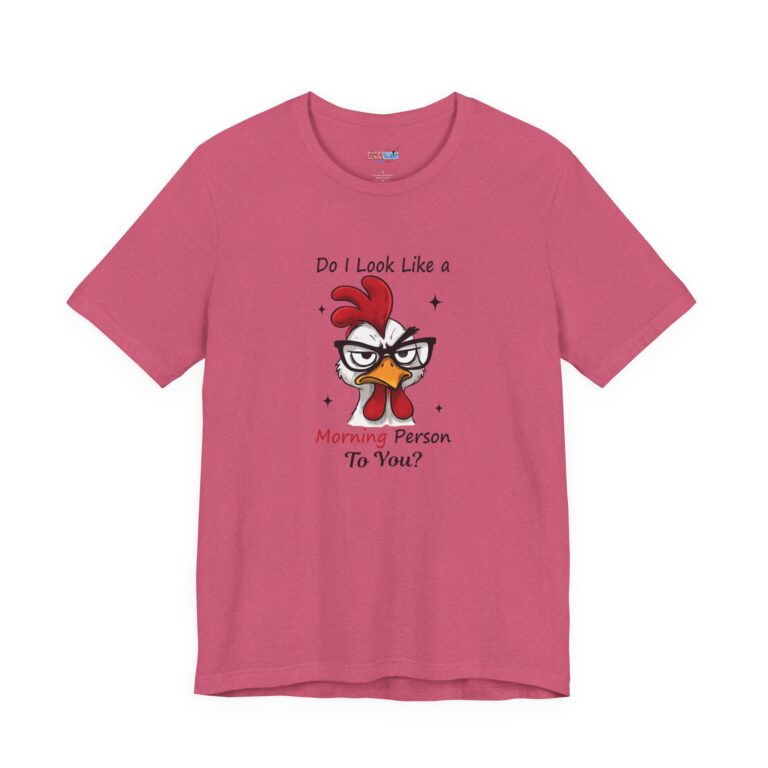 Cinematic studio macro shot of a Bella+Canvas 3001 t-shirt featuring a highly detailed, cheeky rooster illustration with the text "Do I Look Like a Morning Person To You?", highlighting the vibrant ink on the soft cotton.
